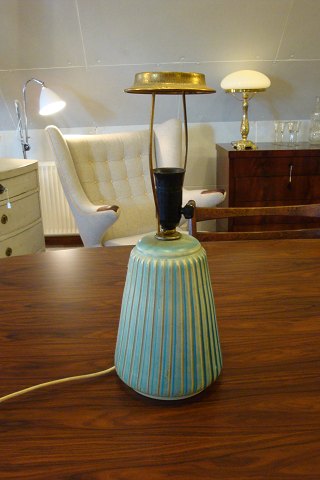 Ceramic table lamp in mint green with grooved surface.   5000m2 showroom.