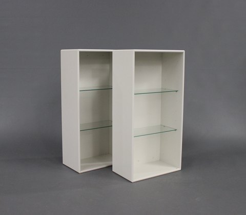 A pair of white Bookcase by Montana with glass shelves.
5000m2 showroom.
