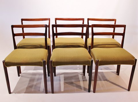 A set of dining room chairs of rosewood and upholstered with green fabric, by 
Knud Færch from the 1960s.
5000m2 showroom.
