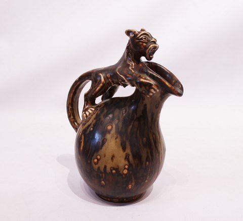 Stoneware jug in brown colors decorated with a tiger by Bode Willumsen for Royal 
Copenhagen.
5000m2 showroom.
