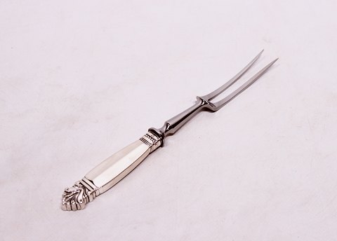 Carving fork in Queen by Georg Jensen.
5000m2 showroom.