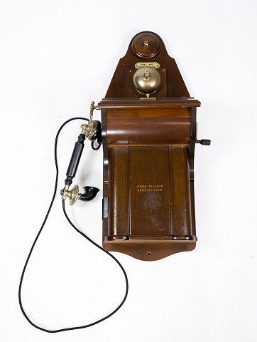 Old phone from Jydsk Phone Stock company of dark wood.
5000m2 showroom.