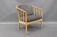 Hvilestol af dansk design. Stolen er i bøgetræ og med lysegrå uld hynder .Stolen 
er i fin stand. 5000 m2 udstilling
