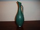 Green vase with small handle By Gunnuar Nylund. 
Height 26 cm and Swedish design. 
5000 m2 showroom.