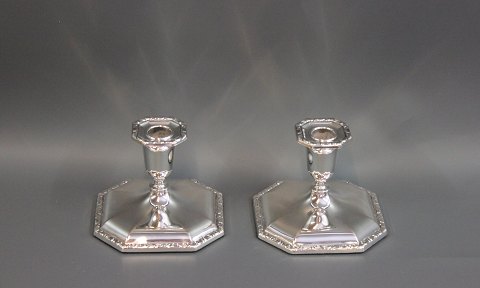 A pair of angular candlesticks in 830s. Model no.: 803 A and master stamped. 
5000m2 showroom.
