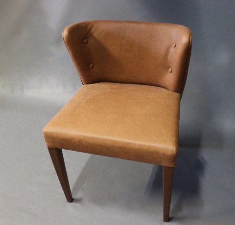 This chair by Egon Bro Pedersen has been reupholstered including restoration of 
the Wood after substantial fire damage.
