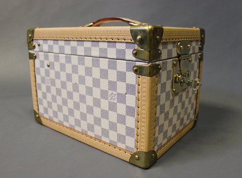 This Louis Vuitton Beauty Trunk has after a robbery atempt had it