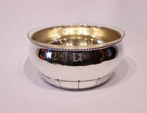 Large bowl of hallmarked silver with glass inside.
5000m2 showroom.

