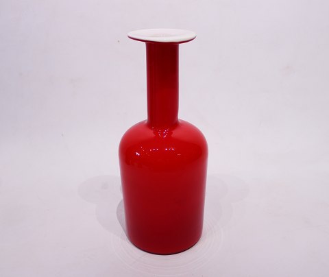 Large red glass vase with white opal glass on the inside by Otto Brauer for 
Holmegaard.
5000m2 showroom.