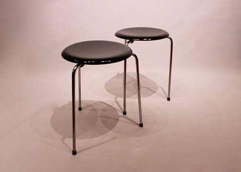 A pair of Dot stools in black by Arne Jacobsen and Fritz Hansen, from 1971.5000m2 showroom.