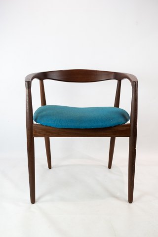 Armchair in rosewood, model Troja, upholstered with blue fabric designed by Kai 
Kristiansen from the 1960s.
5000m2 showroom.