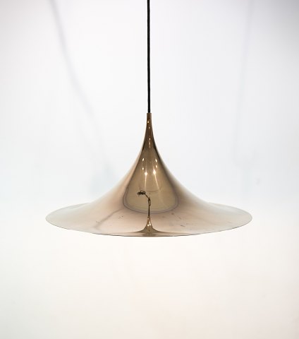 Gold colored Gubi Semi pendant designed by Claus Bonderup and Thorsten Thorup in 1968. 5000m2 showroom.