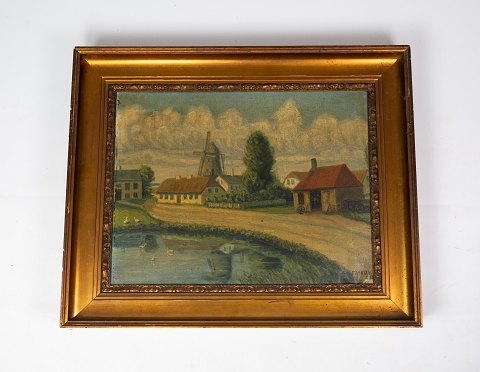 Oilpainting with country village motif and gilded frame, signed Erskov 16.
5000m2 udstilling.