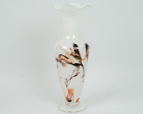 A milky white vase with the composition of golden colors from around the 1970s.
Dimensions in cm: H: 24 D: 9
Great condition
