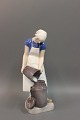 B&G figurine No 2181, Girl with a milk can. Height 22 cm.
5000 m2 showroom.
