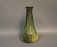Ceramic vase in green and yellow from the 1960s.
5000m2 showroom.