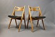 A pair of "Sawbench" dining room chairs in polished beech and suede, model CH29. 

5000m2 showroom.