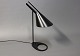 Sort AJ bordlampe, 1808, designet af Arne Jacobsen i 1960 og fremstillet hos 
Louis Poulsen. 
5000m2 udstilling.