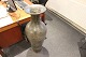 Large ceramic floor vase that we have repaired after it had been broken in 
several pieces.
