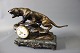 We have just repaired this beautiful Cartier Panther clock, after the tail had 
broken off. We have recreated what was lost and patinated it.
