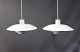 2 White PH4 pendants designed by Poul Henningsen and manufactured by Louis Poulsen.5000m2 showroom.