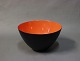 Krenit bowl by Herbert Krenchel in Black metal and orange/red enamel. 
5000m2 showroom.
