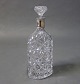 Decanter of crystal with edge of hallmarked silver from the 1930s.
5000m2 showroom.