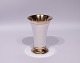 Cup decorated with delictae pearl edge and gilded, stamped C.C.Hermann and of 
925 sterling silver.
5000m2 showroom.