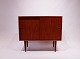 Simpel sideboard in teak with sliding doors and shelves by FM Furniture from the 
1960s.
5000m2 showroom.