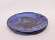 Large round ceramic dish with dark blue glaze and motif of a fish, by 
Pottemagerstuen at Graabrødretorv 1.
5000m2 showroom.