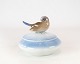 Lidded jar 
decorated with a porcelain figure, no.: 1623 by Royal Copenhagen.
5000m2 showroom.