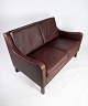 Two seater sofa, with red brown leather by Stouby Furniture.
5000m2 showroom.
