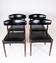 Set of four dining room chairs in rosewood and black leather of danish design 
from the 1960s.
5000m2 showroom.