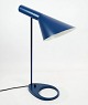 Dark blue table lamp designed by Arne Jacobsen and manufactured by Louis 
Poulsen. 
5000m2 showroom.
