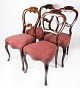 Set of four dining room chair of mahogany and upholstered with red fabric from 
the 1860s.
5000m2 showroom.