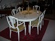 White paintet  dining room Table with two plates and 4 chair + 2 armchairs in 
good condition 
5000 m2 showroom